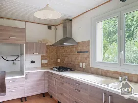 Vente Maison de Type 7 avec jardin.