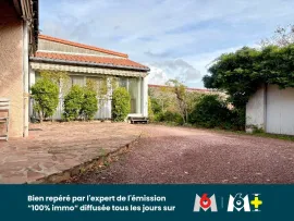 Vente Maison familiale de 150 m² avec double garage, jardin et local commercial de 59 