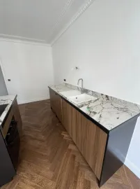 Location A Sophisticated Top-Floor Residence with Parquet and Tall French Windows