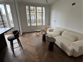 Location A Sophisticated Top-Floor Residence with Parquet and Tall French Windows